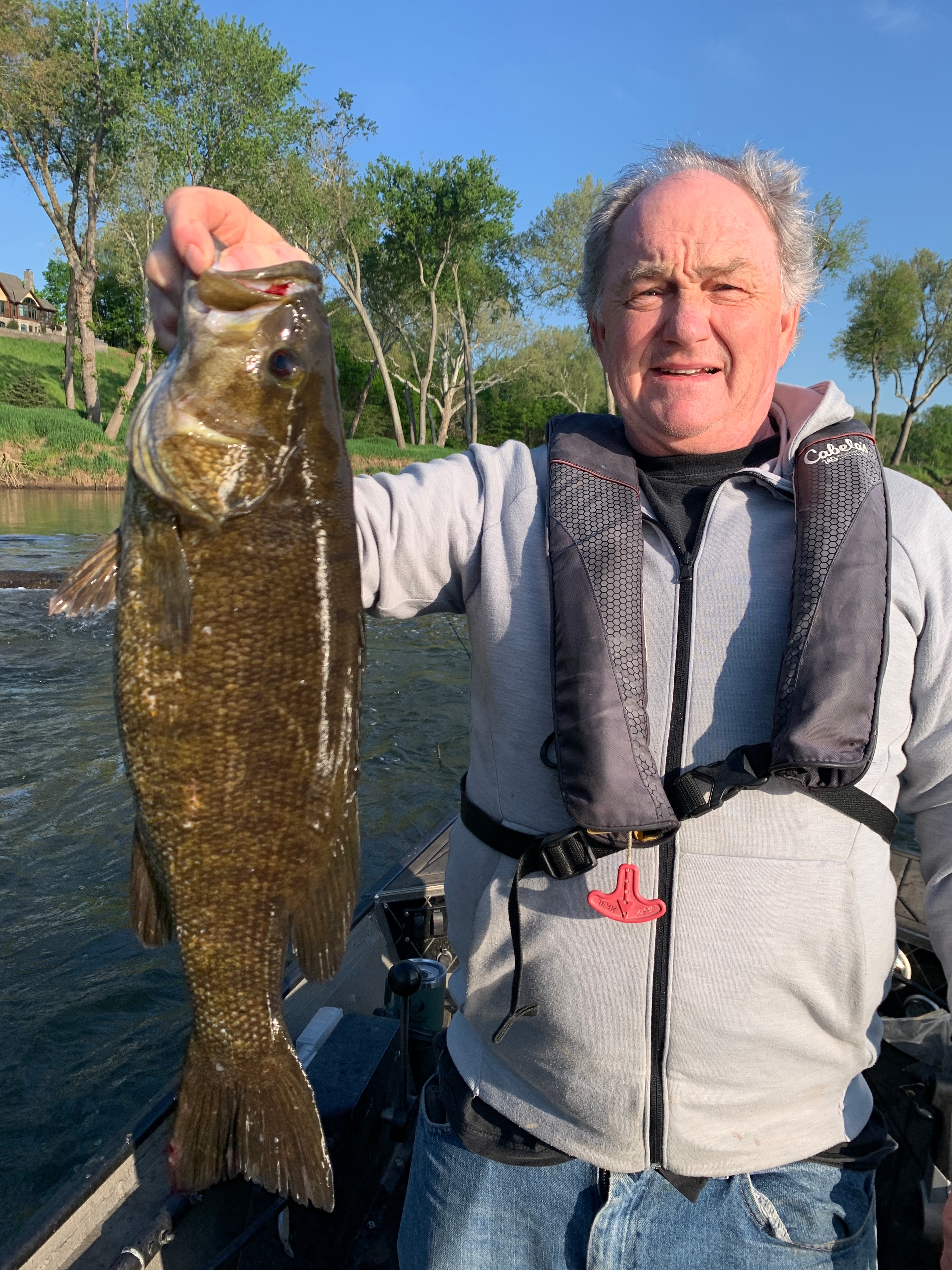 Jeff Greene holding a trophy smallmouth bass